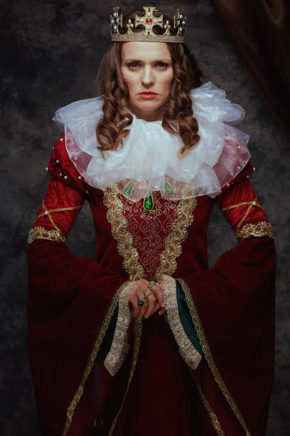 istock medieval queen in red dress with white collar and crown 1482801541