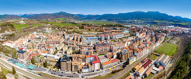 Sabinanigo village in Huesca aerial skyline in Aragon of Spain with snow Pyrenees mountains in background