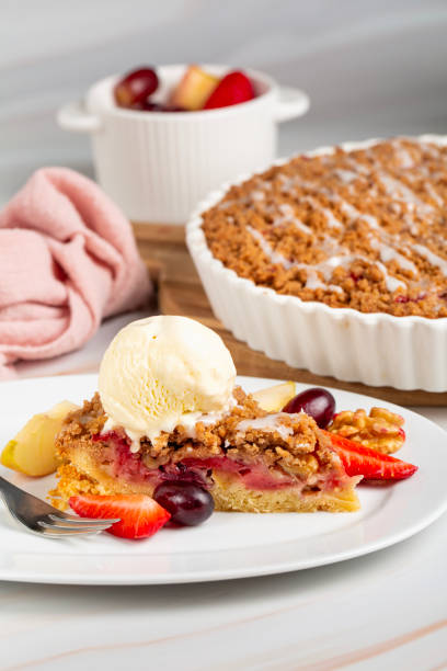 istock Crumble fruit cake with vanilla ice cream ball. Vertical image. 1482803240