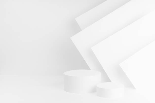 istock Abstract white stage with two cylinder podiums mockup in elegant  geometric style with soft light stripes, scene template for advertising, design, presentation cosmetics, copy space. 1482804693