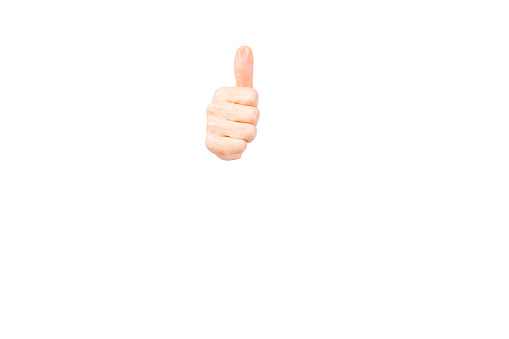 Elderly woman hand or Senior lady hand shows thumbs up isolated on white background only thumb up hand