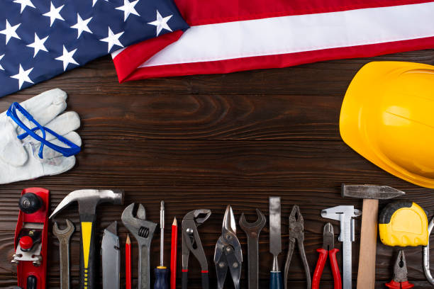 istock Tools hard hat us flag on wooden background labor day mockup 1482810523