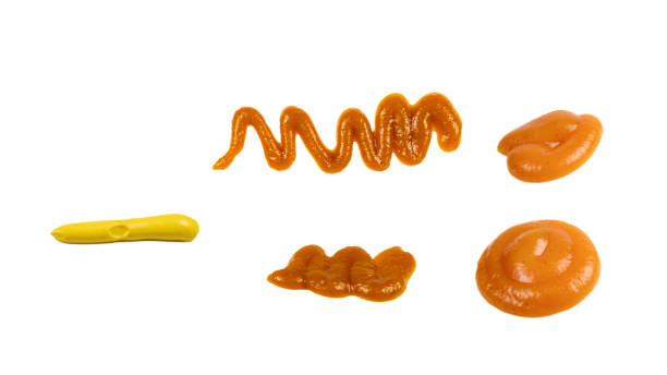 istock Orange sauce splashes isolated on white background 1482810545