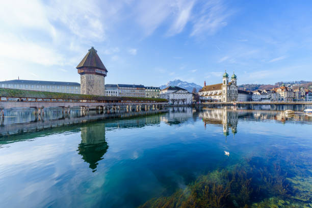 View of the Chapel Bridge, the Jesuit Church St Francis Cavier, and the Reuss River, in Lucerne (Luzern), Switzerland