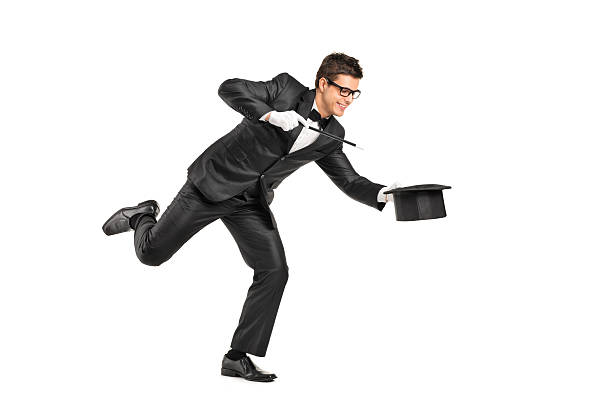 istock Magician holding a magic wand and gesturing 148281079
