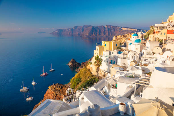 Famous Panoramic view of Santorini, Greece. White architecture, yachts and the blue sea of the island of Santorini against the background of the sea. stock photo