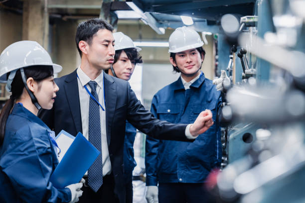 istock Management directing factory workers to be more efficient 1482814301