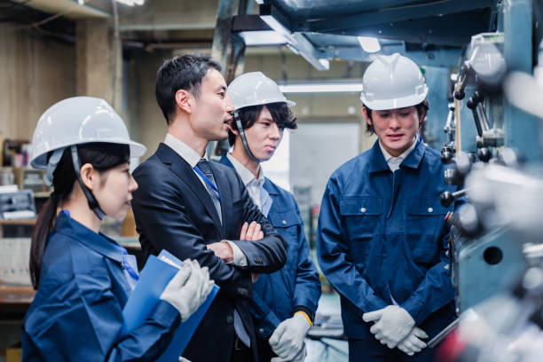 istock Management directing factory workers to be more efficient 1482814303