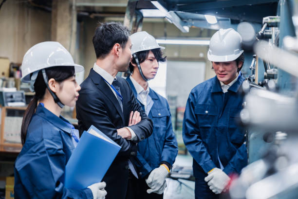 istock Management directing factory workers to be more efficient 1482814304