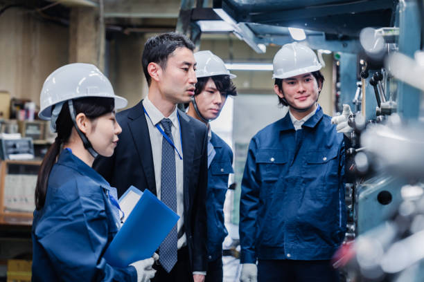 istock Management directing factory workers to be more efficient 1482814315