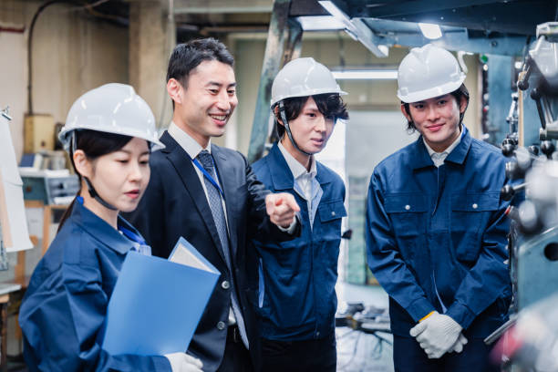 istock Management directing factory workers to be more efficient 1482814323