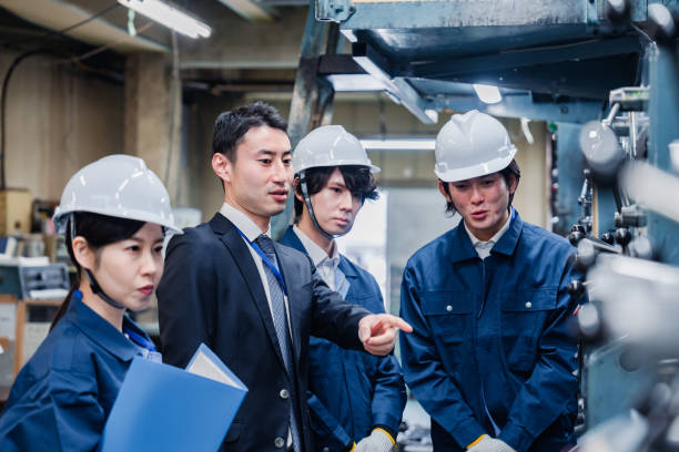 istock Management directing factory workers to be more efficient 1482814337