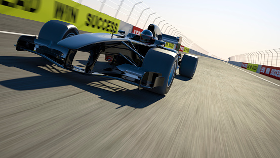 Front view of a racing car on a race track. This car is designed and modelled by myself. Very high resolution 3D render.