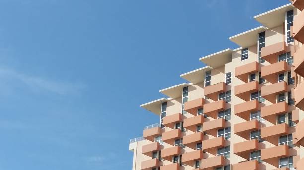 This is a photograph of a part of a large Art Deco building balconies with blue sky in Miami Beach, Florida USA.