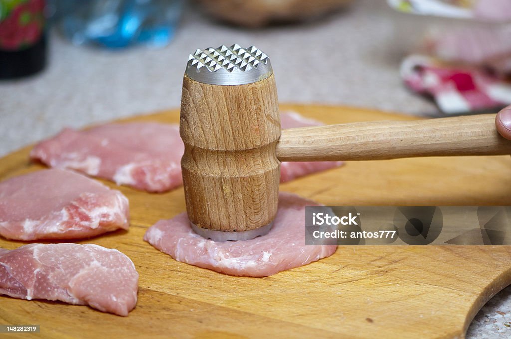 tenderize slabs of meat on wooden board tenderize slabs of fresh meat on wooden boardtenderize slabs of fresh meat on wooden board Beef Stock Photo