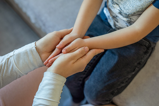 Sharing physical and emotional pain with children