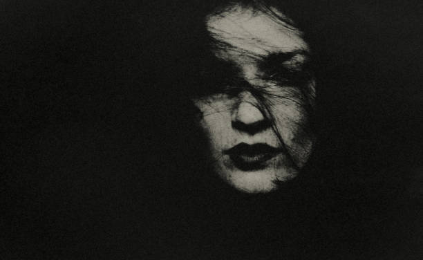 istock The young woman in the darkness. 1482826742