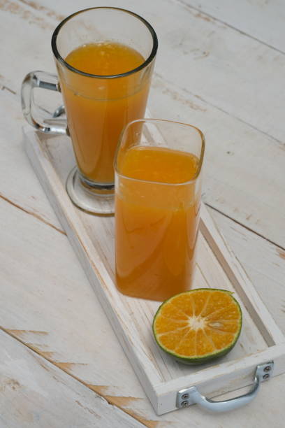 istock Fresh Orange Juice in Clear Glass 1482826777
