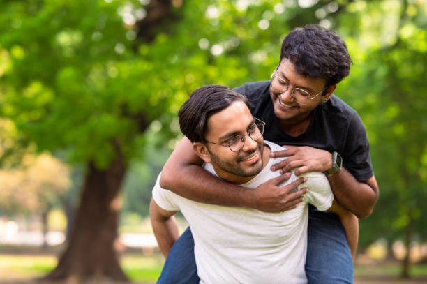 istock Cheerful young friends having fun at park 1482828343
