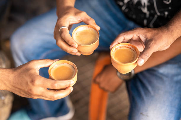 istock Clay tea cup being hold in the hand 1482828621