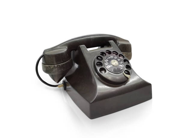 istock Old fashioned desk phone, side view isolated against white background 1482828743