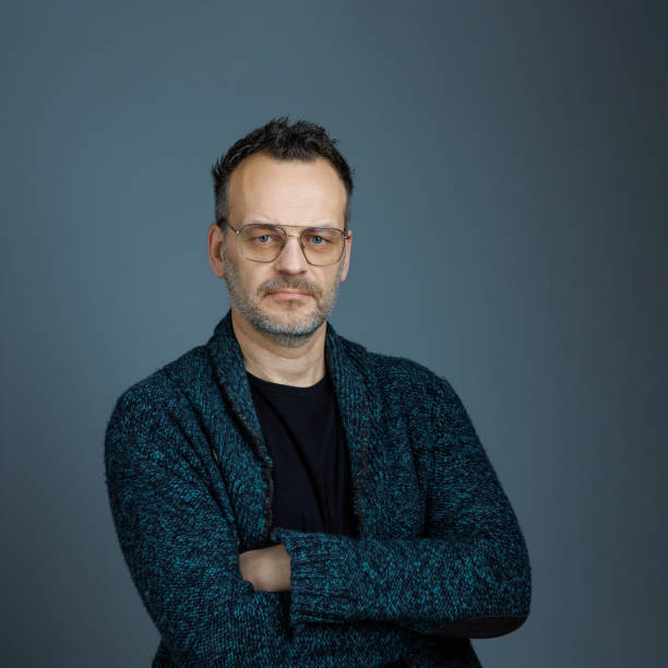 istock Mid adult man with arms crossed. 1482829488