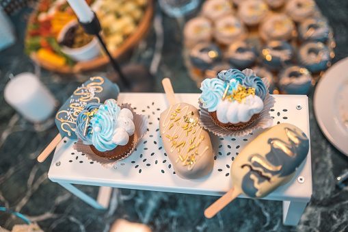 A delectable assortment of desserts, ranging from classic to exciting new flavors of sweet treats. Baby shower celebration.