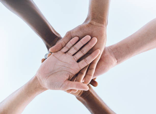 istock Sports, teamwork and stack of hands for support, motivation and community with  blue sky. Collaboration, team building and group of people ready for success in game, fitness and training outdoors 1482832098