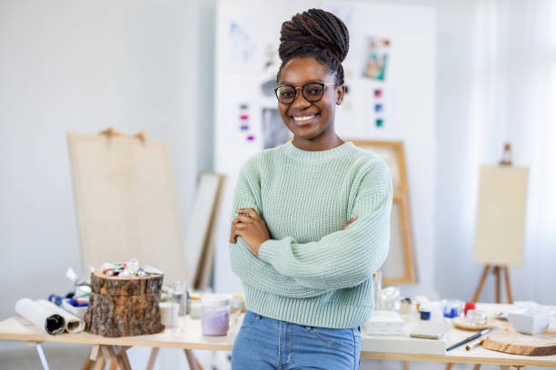 istock Young female artist is in her painting studio 1482835152