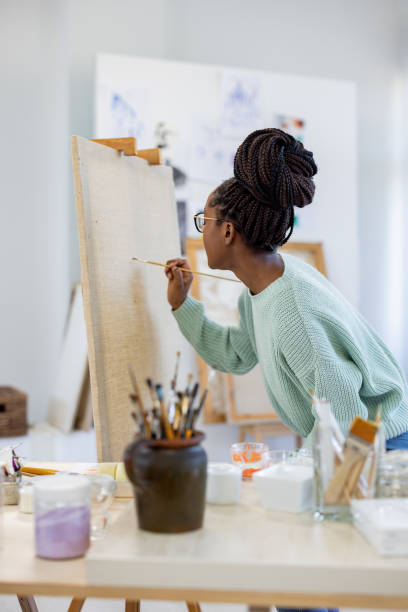 istock Young artist working in her painting studio 1482836131