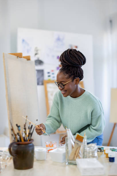istock Young artist working in her painting studio 1482836684