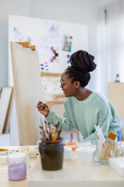 istock Young artist working in her painting studio 1482836685