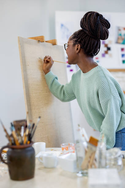 istock Young artist working in her painting studio 1482836689