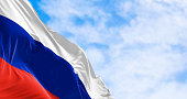 The national flag of Russia waving in the wind on a clear day