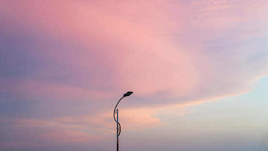 street lamp with purple clouds