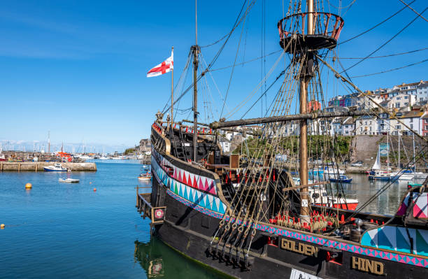 Bristol, United Kingdom - June 27 2 2023:  A replica of John Cabot's ship Matthew in Bristol Docks, in the background Cabot Tower, Bristol, United Kingdom