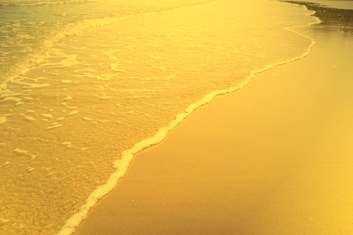 Shiny gold beach texture,abstract background,golden pattern