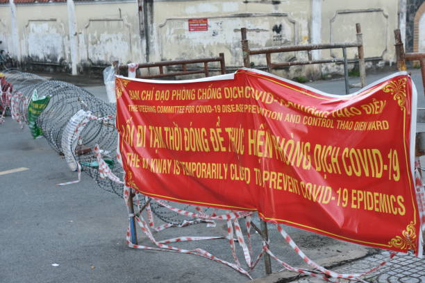 istock Covid-19 Road Closure Quarantine Banner with Barbed Wire 1482840881