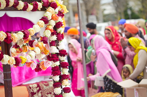 Nagar Kirtan procession, religious sikh event in the streets of the city. Marene, Italy - April 2023