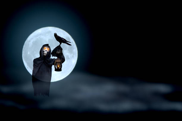 istock Grim Reaper and crow with super moon blur background,Halloween day,Ghost puppet 1482841464
