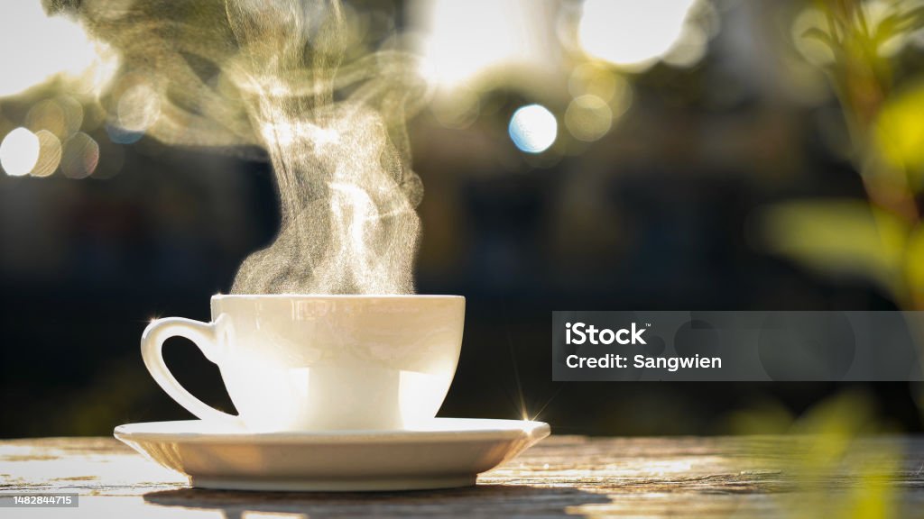 https://media.istockphoto.com/id/1482844715/photo/hot-coffee-mug-close-up-natural-steam-smoke-of-coffee-from-hot-coffee-cup-on-old-wooden-table.jpg?s=1024x1024&w=is&k=20&c=AgMFedHsEux2mBmG2210uSxNkuOaU913l4h9wnC8fVk=