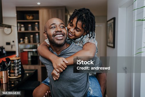 istock Father and carrying son on shoulders 1482845830