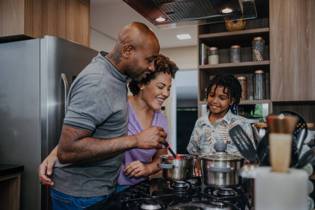 istock Couple cooking together with son in the kitchen 1482845833