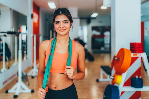 Portrait of young woman in the gym