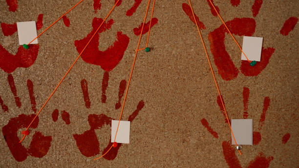 istock handprints of red, bloody color, on a cork board 1482851795