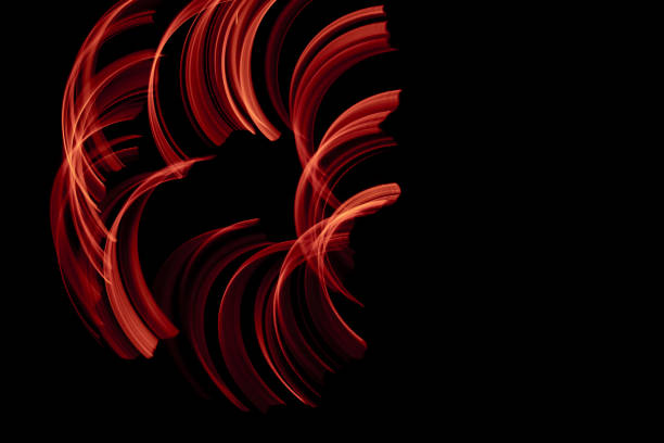 istock burning in motion. lines of fire in the dark 1482852849