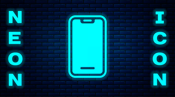 Glowing neon Smartphone, mobile phone icon isolated on brick wall background. Vector.