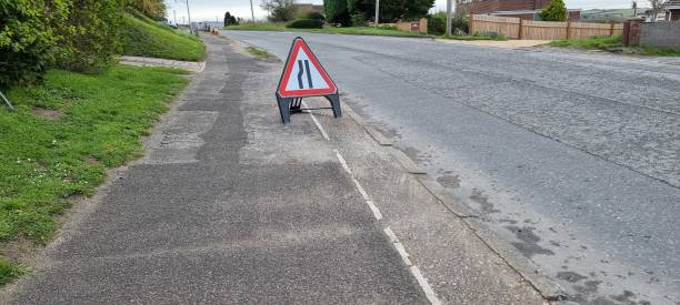 istock Road work in progress narrow lane sign 1482854230