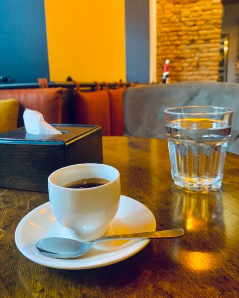istock Cozy Coffee Shop Crop with Espresso and Water Cup 1482855335