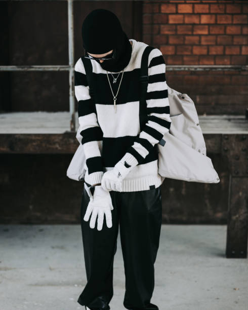 Good Looking Young Man Wearing Modern Gloves Fashion Outfit Portrait Cool looking young man wearing modern gloves. Youth culture high fashion real people millennial generation outdoors lifestyle portrait jugendkultur stock pictures, royalty-free photos & images